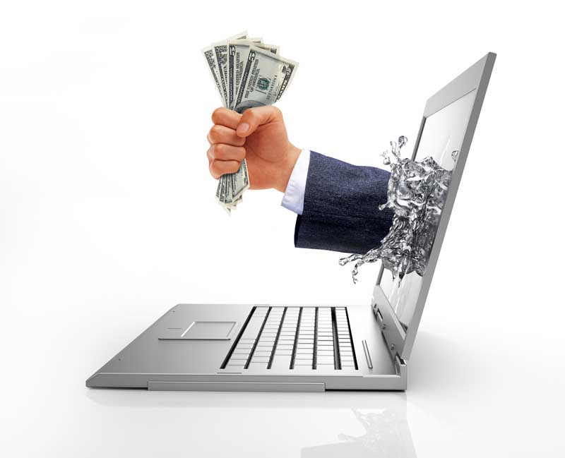 دانلود تصویر با کیفیت مشتی اسکناس بیرون آمده از نمایشگر لپ تاپ